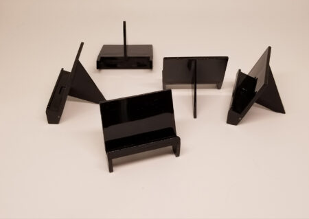A pack of Black Pro Mold Card Stands - Pack Of 10 stands on a white surface.