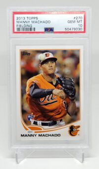 a 2013 Topps Manny Machado Rookie #270 PSA 10 with a picture of a baseball player.