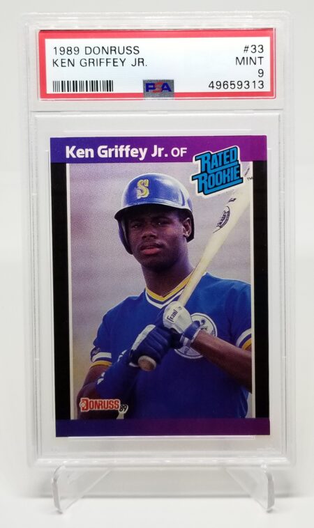 a 1990 Donruss Ken Griffey Jr. #33 PSA 9 with a picture of ken griffey.
