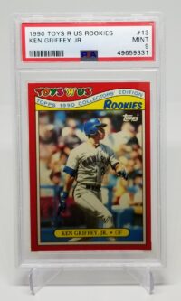 a card with a picture of a 1990 Topps Toys R Us Ken Griffey Jr. #13 PSA 9 baseball player.