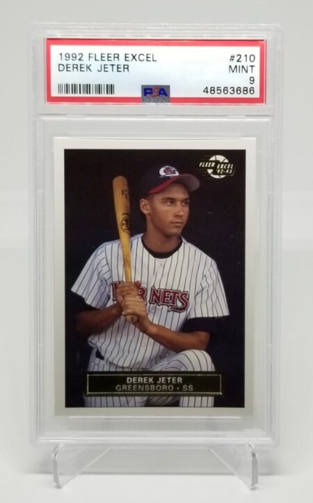 a 1992 Fleer Excel Derek Jeter #210 PSA 9 baseball card with a picture of a player.